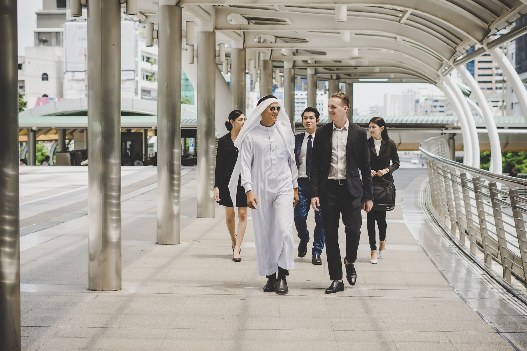 business-partners-team-walking-down-and-discussing-work_1150-302