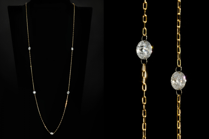 Макросъемка золотой цепочки с танцующими бриллиантами