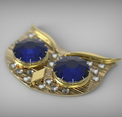 Золотая брошь с камнями