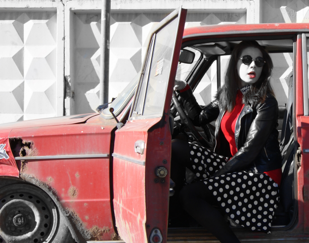 Woman in red car