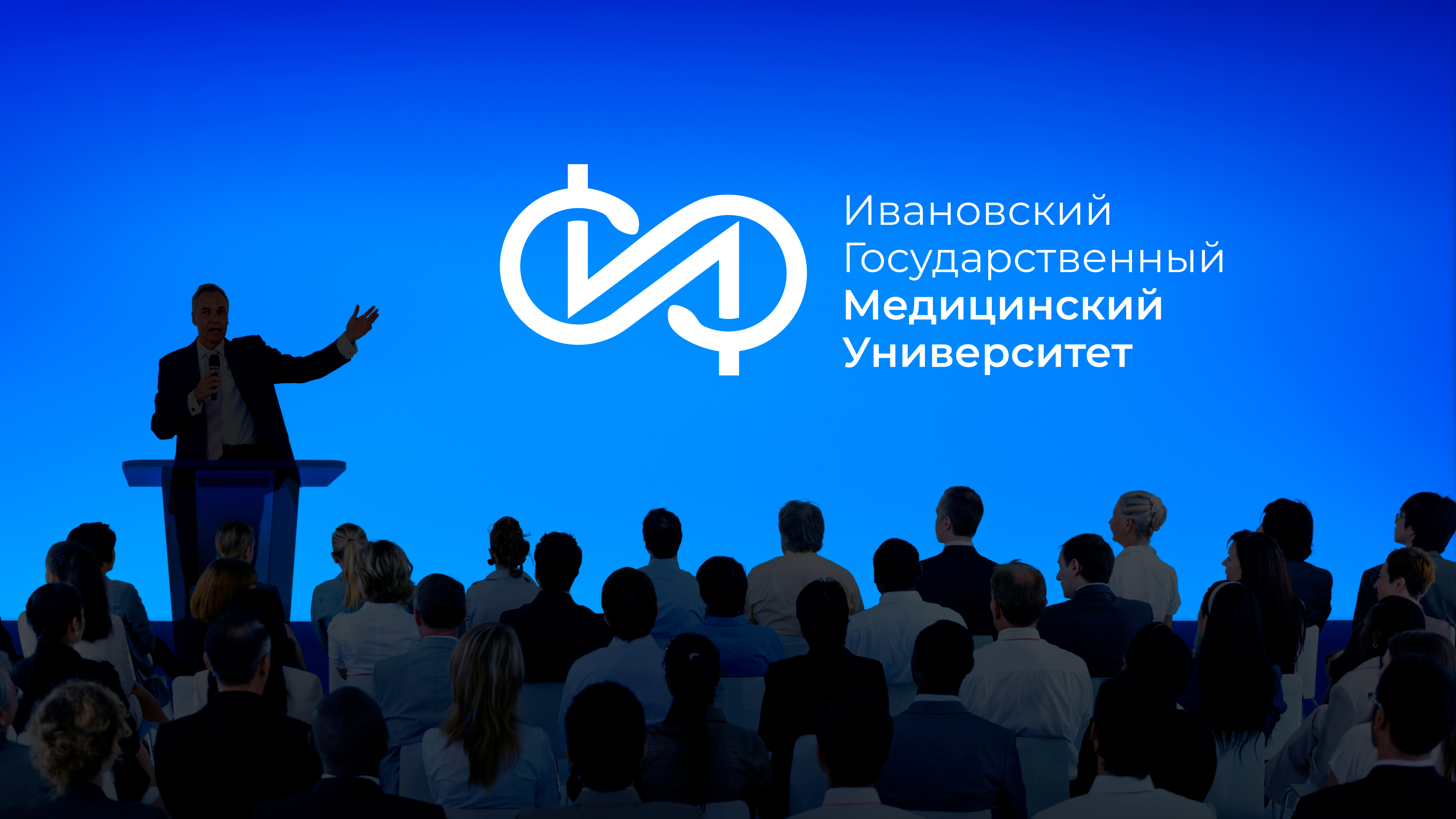 corporate-businessman-giving-presentation-large-audience.jpg