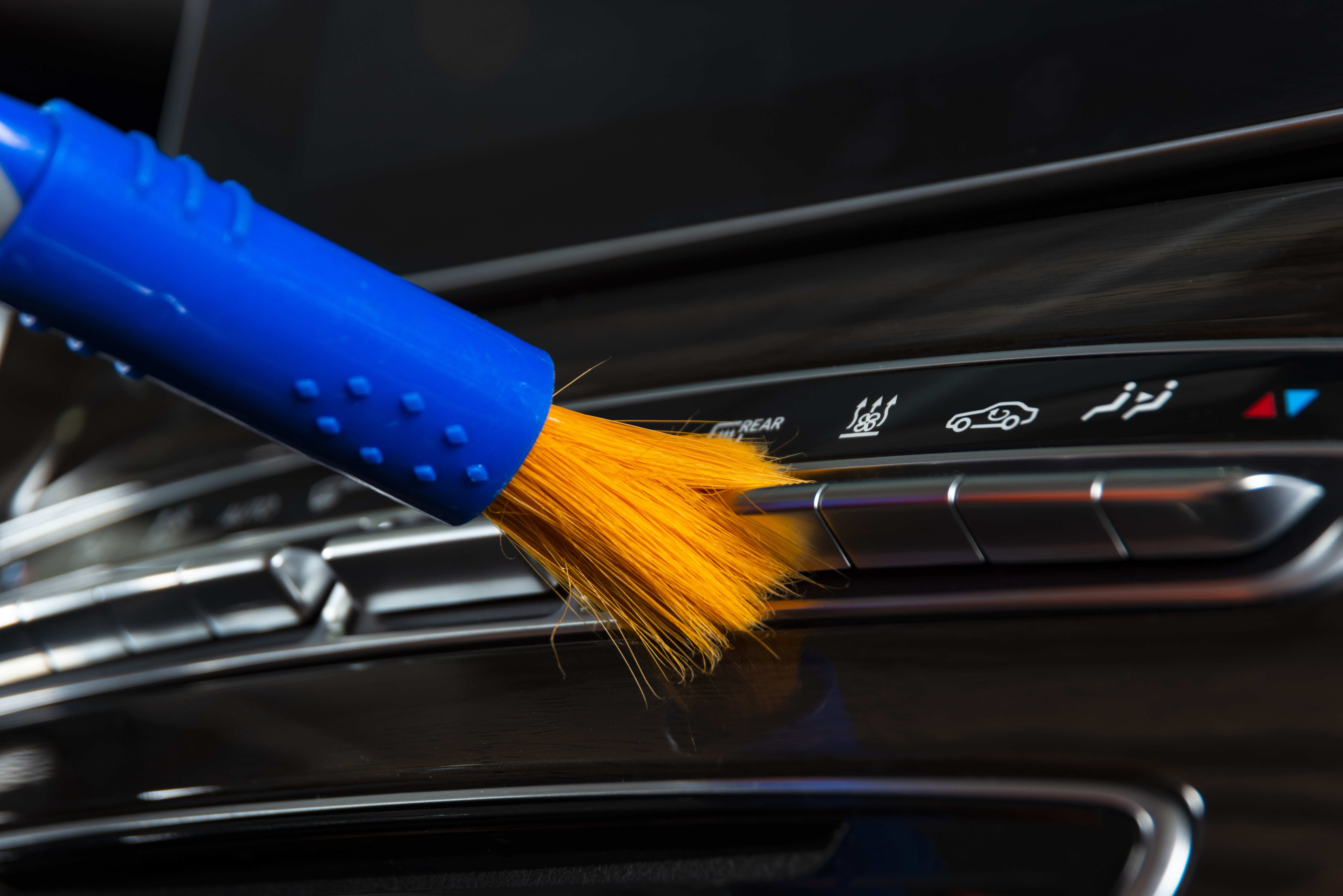 Brush cleaning off dust from the car interior details 4.jpg