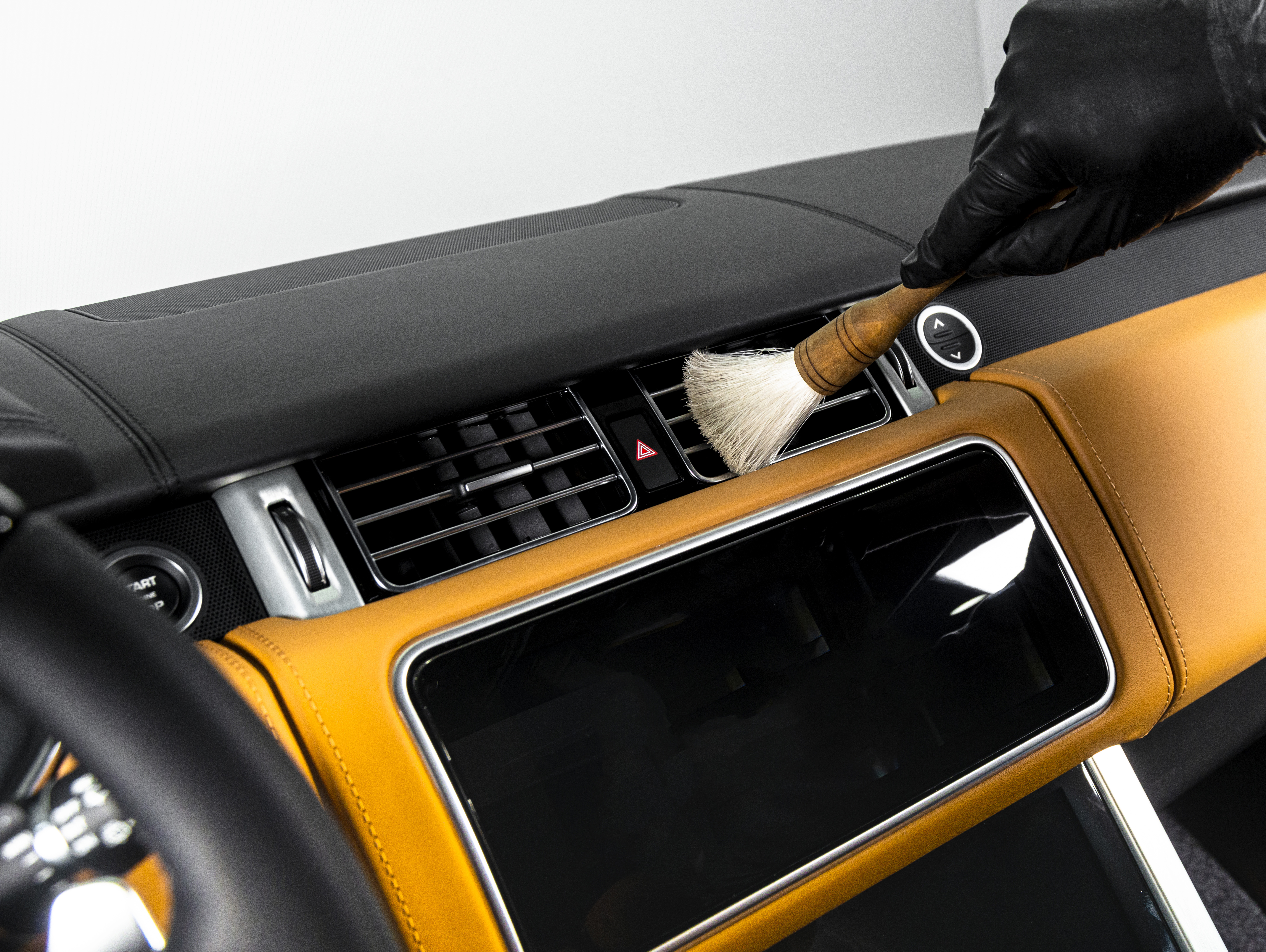 Brush cleaning off dust from the car interior details 3.jpg