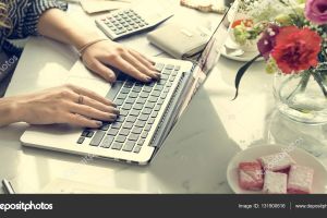 depositphotos_131900616-stock-photo-woman-working-on-laptop