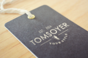 Логотип магазина одежды TOM SOYER