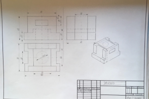 Деталь в 3-х проекциях с изометрическим изображением.